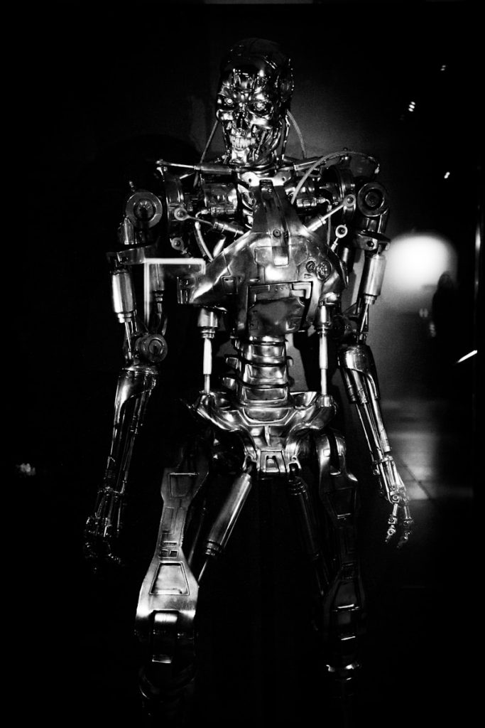 a black and white photo of a robot